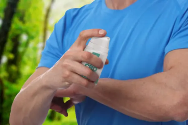 Man applying CBD Pain Cream to his arm