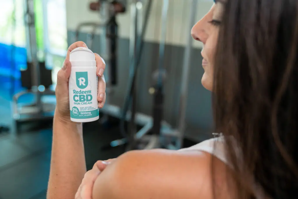 CBD pain cream for shoulder and back pain in use at the gym